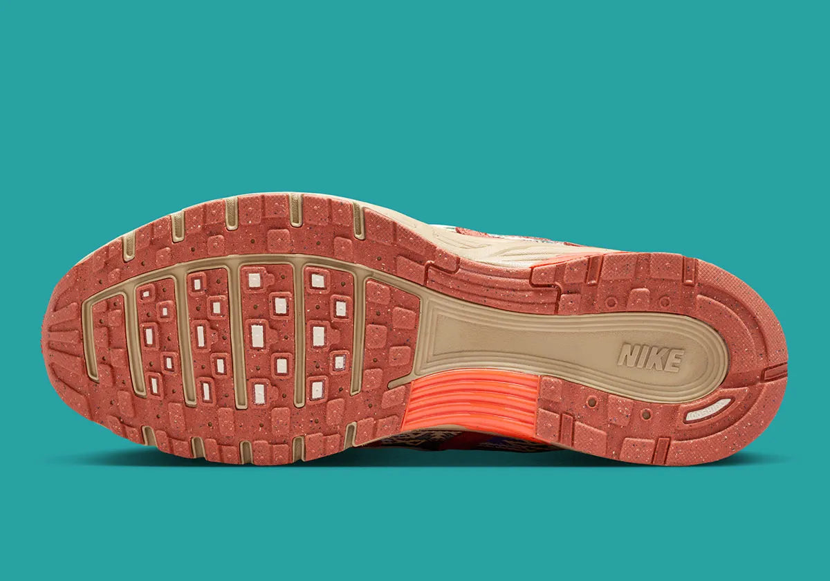 Sneaker Nike P-6000 N7 en mesh technique avec détails inspirés des cultures autochtones, amorti confortable et silhouette rétro-running des années 2000 vue de profil