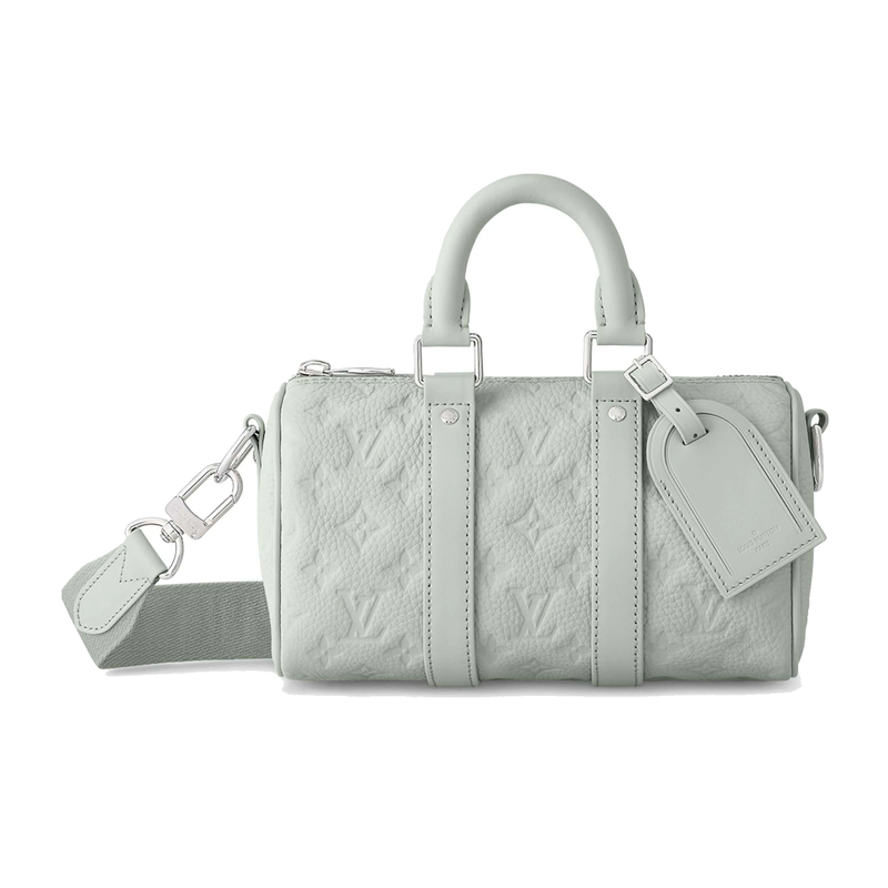 Louis Vuitton Keepall Bandoulière 25 Mineral Gray en cuir de veau grainé embossé Monogram gris avec poignées roulées, bandoulière amovible, fermeture zippée et finitions métalliques.