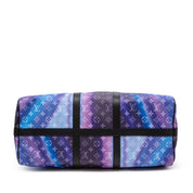 Louis Vuitton Keepall Bandoulière 50 Sunset Monogram Multicolor en toile Monogram multicolore avec garnitures en cuir naturel, poignées roulées, bandoulière amovible, fermeture zippée et finitions métalliques.