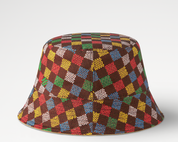 Louis Vuitton LV Vers Damier Reversible Bucket Hat Brown en textile brun, motif Damier, conception réversible et silhouette bucket hat élégante au style contemporain.