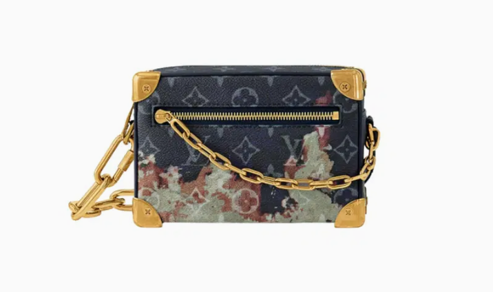 Louis Vuitton Mini Soft Trunk Ink Blue en toile Monogram Bleach bleu encre avec finitions métalliques dorées vieillies et format compact.