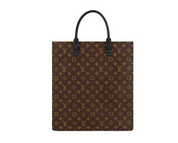 Louis Vuitton Sac Plat M45667 en toile Monogram noire avec détails orange, poignées en cuir, bandoulière amovible, fermeture zippée et silhouette structurée.