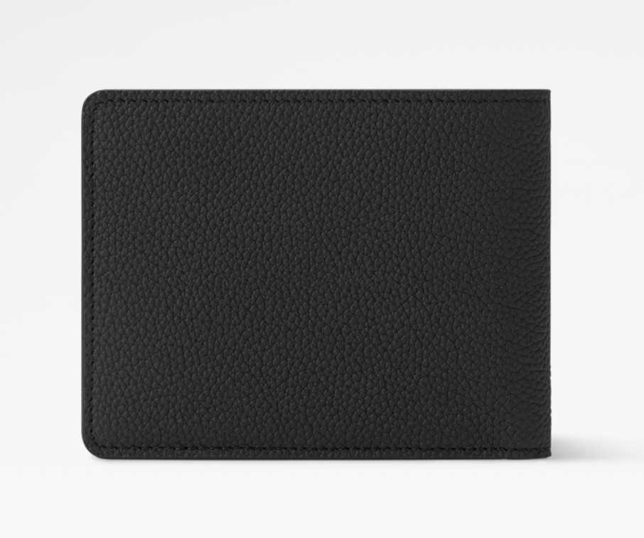 Louis Vuitton Slender Wallet Taiga Black en cuir Taïga noir texturé, format compact à deux volets avec silhouette fine.