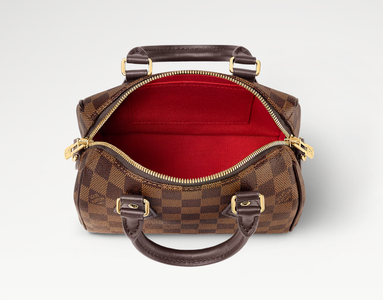 Louis Vuitton Speedy Bandoulière 20, sac Louis Vuitton compact avec doubles poignées Toron, fermeture zippée et bandoulière ajustable.