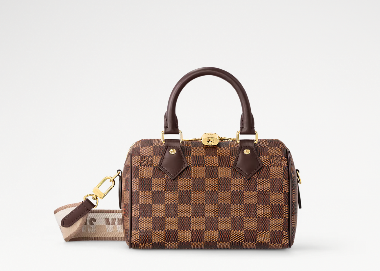 Louis Vuitton Speedy Bandoulière 20, sac Louis Vuitton compact avec doubles poignées Toron, fermeture zippée et bandoulière ajustable.