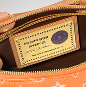 Louis Vuitton Speedy P9 Bandoulière 25 Summer Peach, sac Louis Vuitton en cuir souple coloris pêche avec motif Monogram et bandoulière ajustable.
