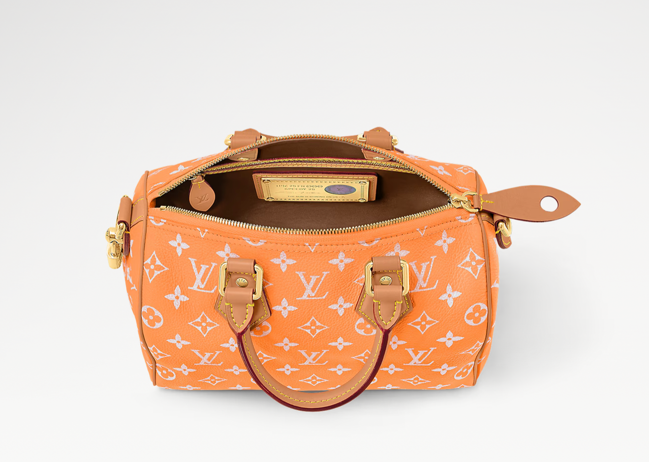 Louis Vuitton Speedy P9 Bandoulière 25 Summer Peach, sac Louis Vuitton en cuir souple coloris pêche avec motif Monogram et bandoulière ajustable.