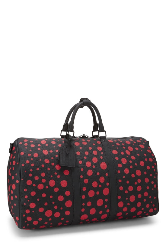 Louis Vuitton x Yayoi Kusama Keepall 50 Black/Red avec motifs signatures rouges de Yayoi Kusama sur fond noir, poignées roulées, bandoulière amovible, fermeture zippée et finitions métalliques.