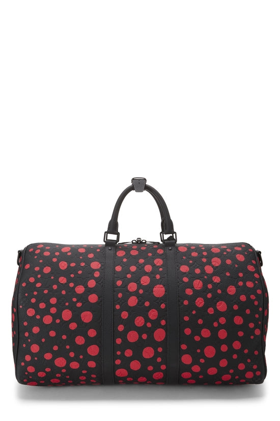 Louis Vuitton x Yayoi Kusama Keepall 50 Black/Red avec motifs signatures rouges de Yayoi Kusama sur fond noir, poignées roulées, bandoulière amovible, fermeture zippée et finitions métalliques.
