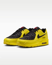 Sneaker Nike Air Max 90 Zest T90 Laser jaune en mesh technique avec semelle Air visible et détails inspirés de la Total 90.