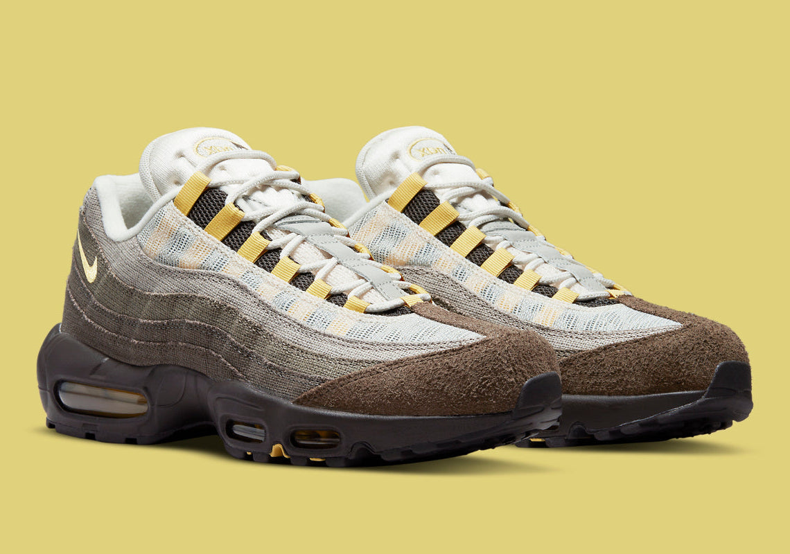 Nike Air Max 95 NH Ironstone en tons brun, taupe et Olive Grey avec panneaux en textile jacquard, détails Celery et unités Air-Sole visibles vue de 3/4 face. 