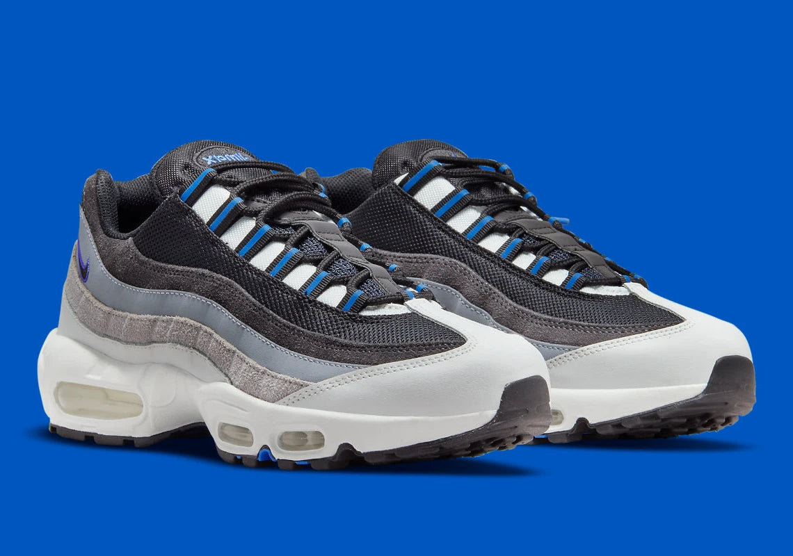 Nike Air Max 95 Medium Blue noire et grise avec empiècements dégradés, détails bleu Medium Blue et unités Air visibles.
