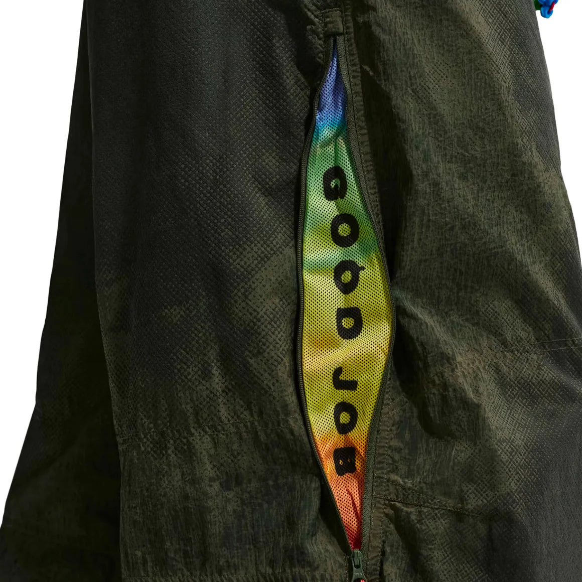 Nike ACG x CPFM Pant Multicolor, pantalon streetwear ample multicolore avec imprimé effet taches d’huile et détails techniques ACG.