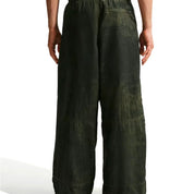 Nike ACG x CPFM Pant Multicolor, pantalon streetwear ample multicolore avec imprimé effet taches d’huile et détails techniques ACG.