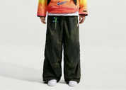 Nike ACG x CPFM Pant Multicolor, pantalon streetwear ample multicolore avec imprimé effet taches d’huile et détails techniques ACG.