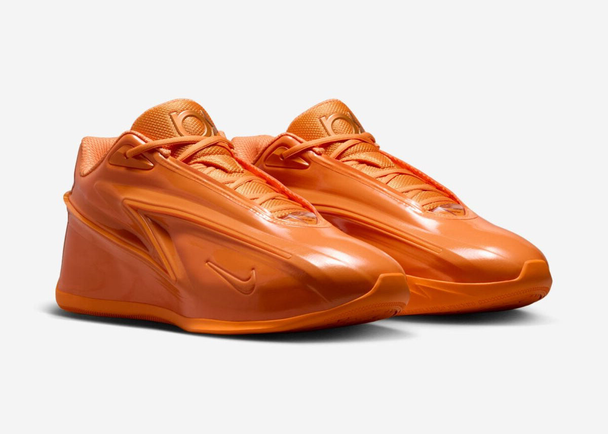 Sneaker Nike KD 19 Bright Ceramic orange vif avec tige en mesh technique, amorti Zoom Air et design performance basketball.