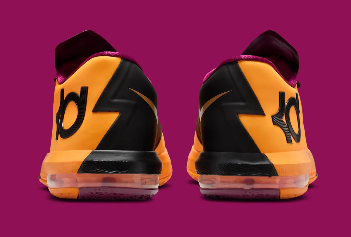 Nike KD 6 Peanut Butter & Jelly 2026 avec tige en mesh et matériaux synthétiques Laser Orange, détails Raspberry Red, grand Swoosh violet, amorti Zoom Air à l'avant-pied et Max Air au talon.