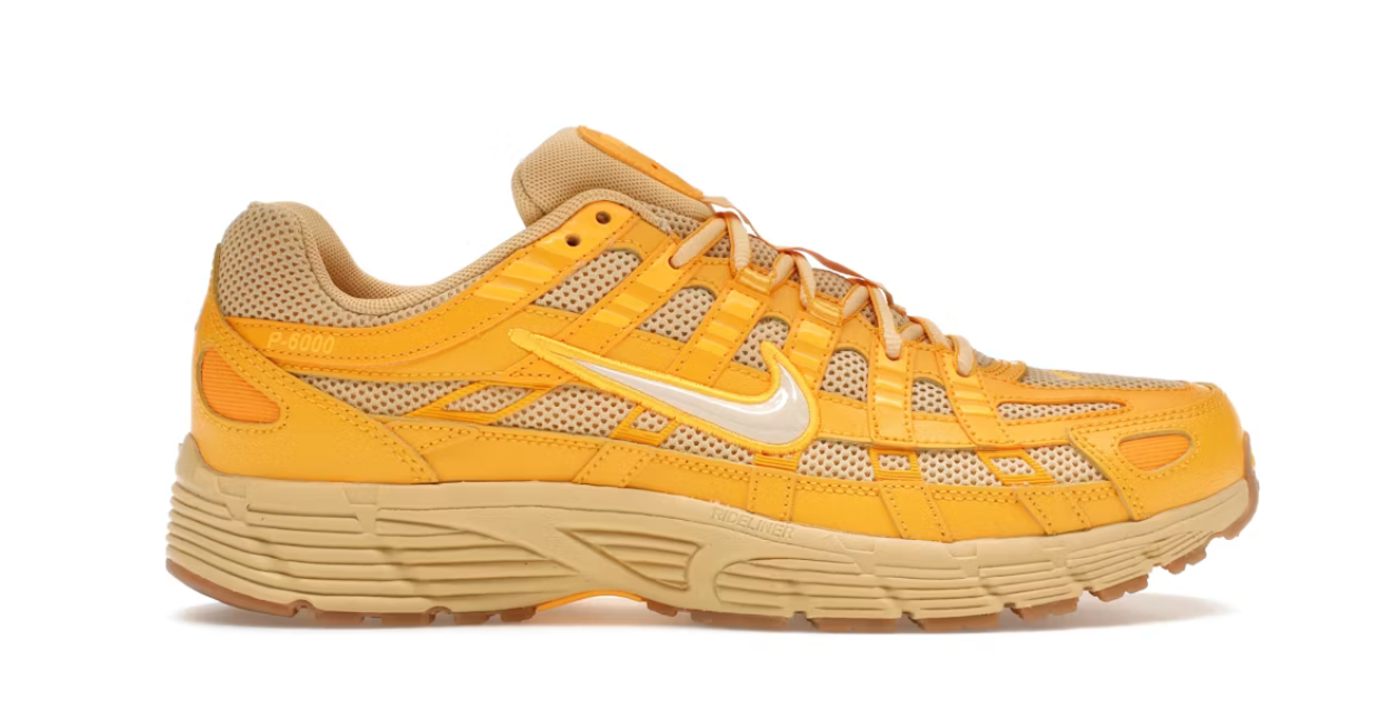 Nike P-6000 University Gold jaune doré et beige avec tige en mesh, empiècements multicouches et semelle extérieure Gum Light Brown.