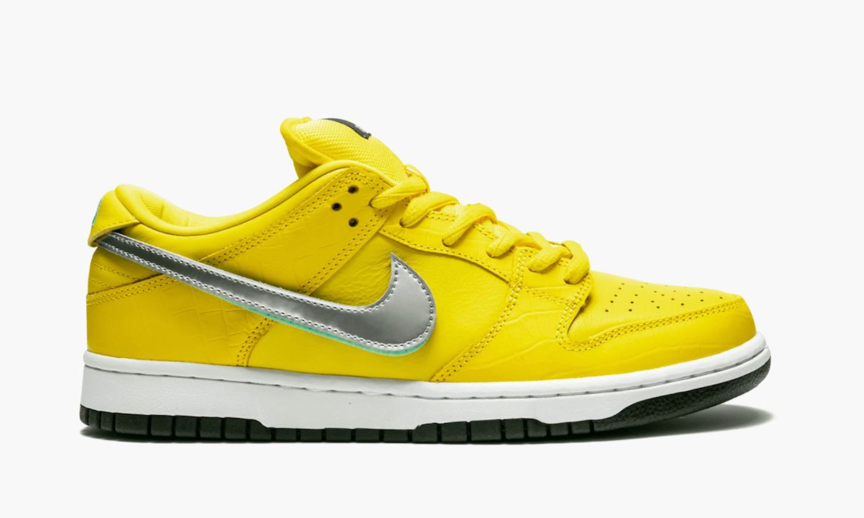 Nike SB Dunk Low Diamond Supply Co. Canary Diamond, sneaker de skateboard issue de la collaboration Nike SB x Diamond Supply Co. avec coloris jaune Canary et finitions premium.