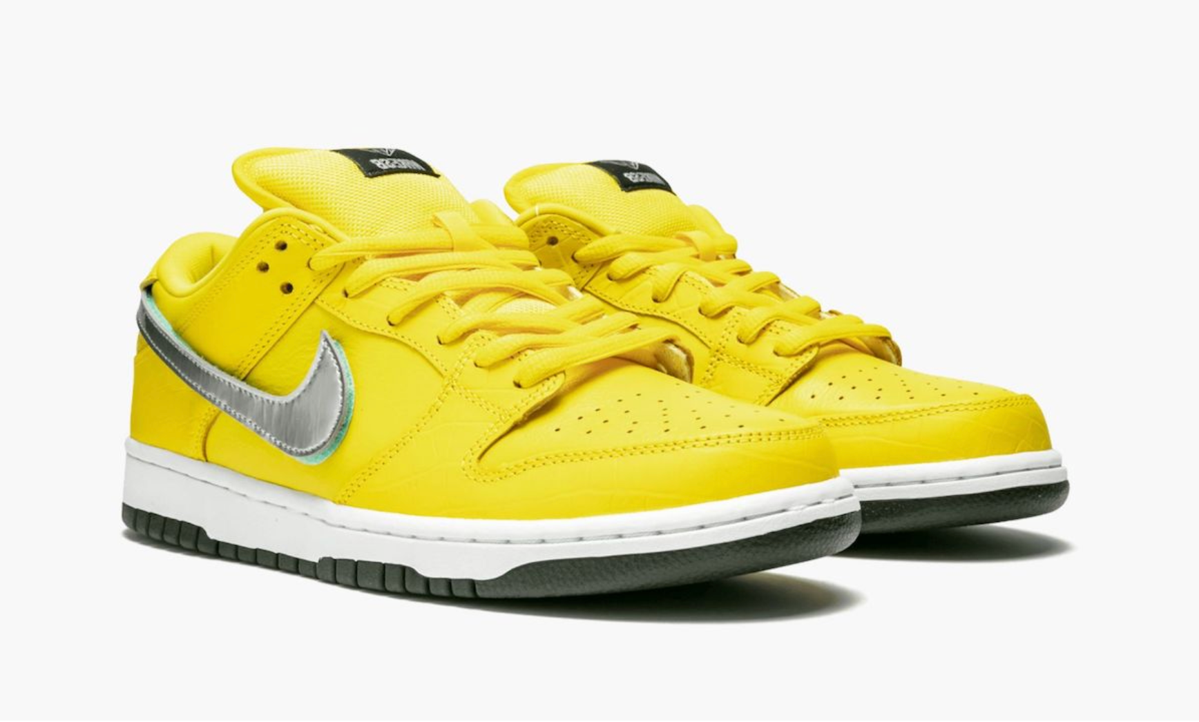 Nike SB Dunk Low Diamond Supply Co. Canary Diamond, sneaker de skateboard issue de la collaboration Nike SB x Diamond Supply Co. avec coloris jaune Canary et finitions premium.