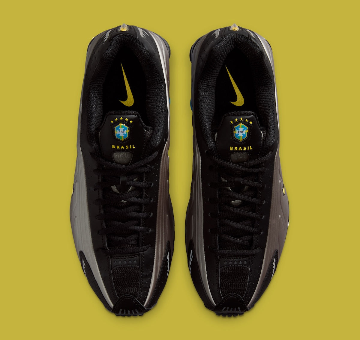 Nike Shox R4 Brazil avec tige en mesh noir et empiècements synthétiques, détails Canary et Light Photo Blue, amorti Nike Shox et semelle extérieure en caoutchouc.