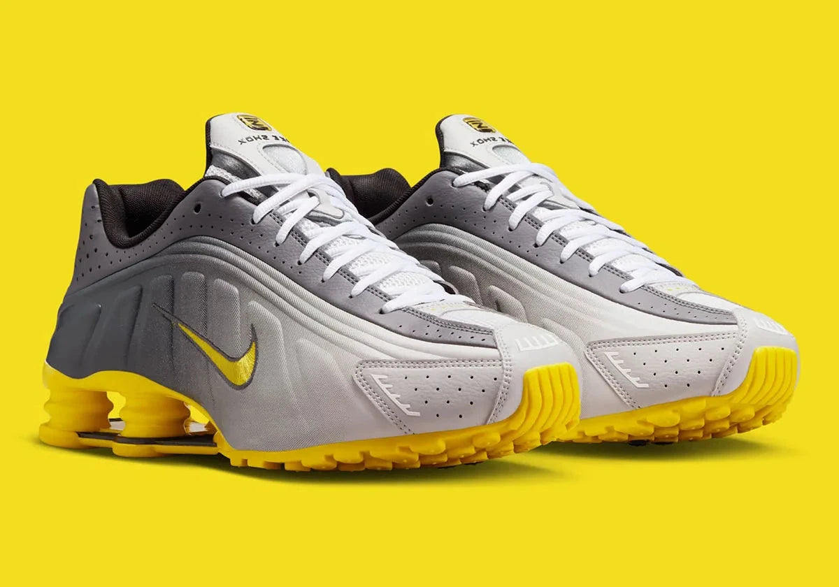 Nike Shox R4 Bright Citron avec tige en matières synthétiques et textile en dégradé de gris, Swoosh et colonnes Shox jaune Bright Citron, perforations respirantes et semelle extérieure en caoutchouc.