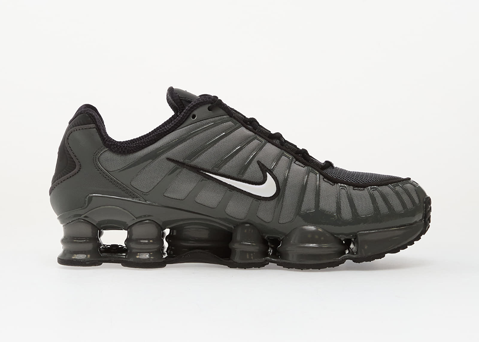 Nike Shox TL SE Iron Grey avec tige en mesh respirant, renforts synthétiques Iron Grey et semelle Nike Shox intégrale offrant amorti, stabilité et confort vue de profil intérieur. 