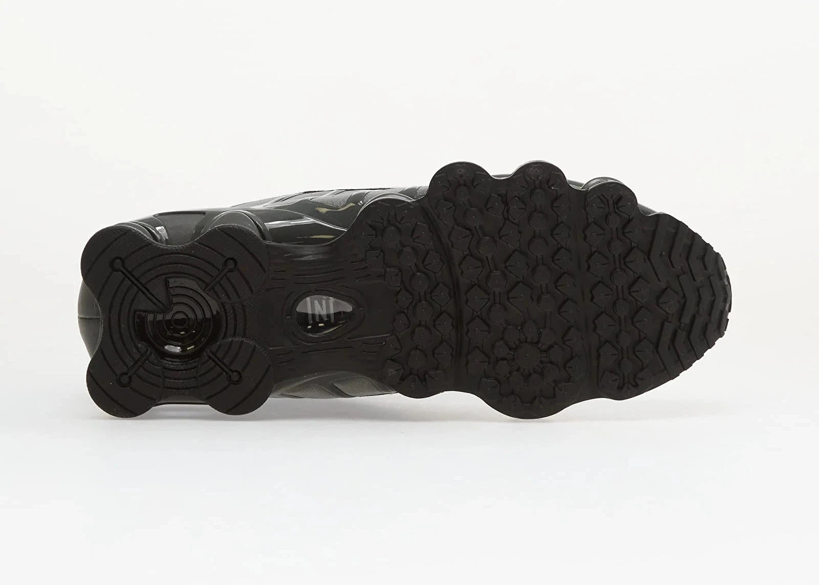 Nike Shox TL SE Iron Grey avec tige en mesh respirant, renforts synthétiques Iron Grey et semelle Nike Shox intégrale offrant amorti, stabilité et confort vue de dessous. 