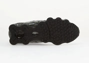 Nike Shox TL SE Iron Grey avec tige en mesh respirant, renforts synthétiques Iron Grey et semelle Nike Shox intégrale offrant amorti, stabilité et confort vue de dessous. 