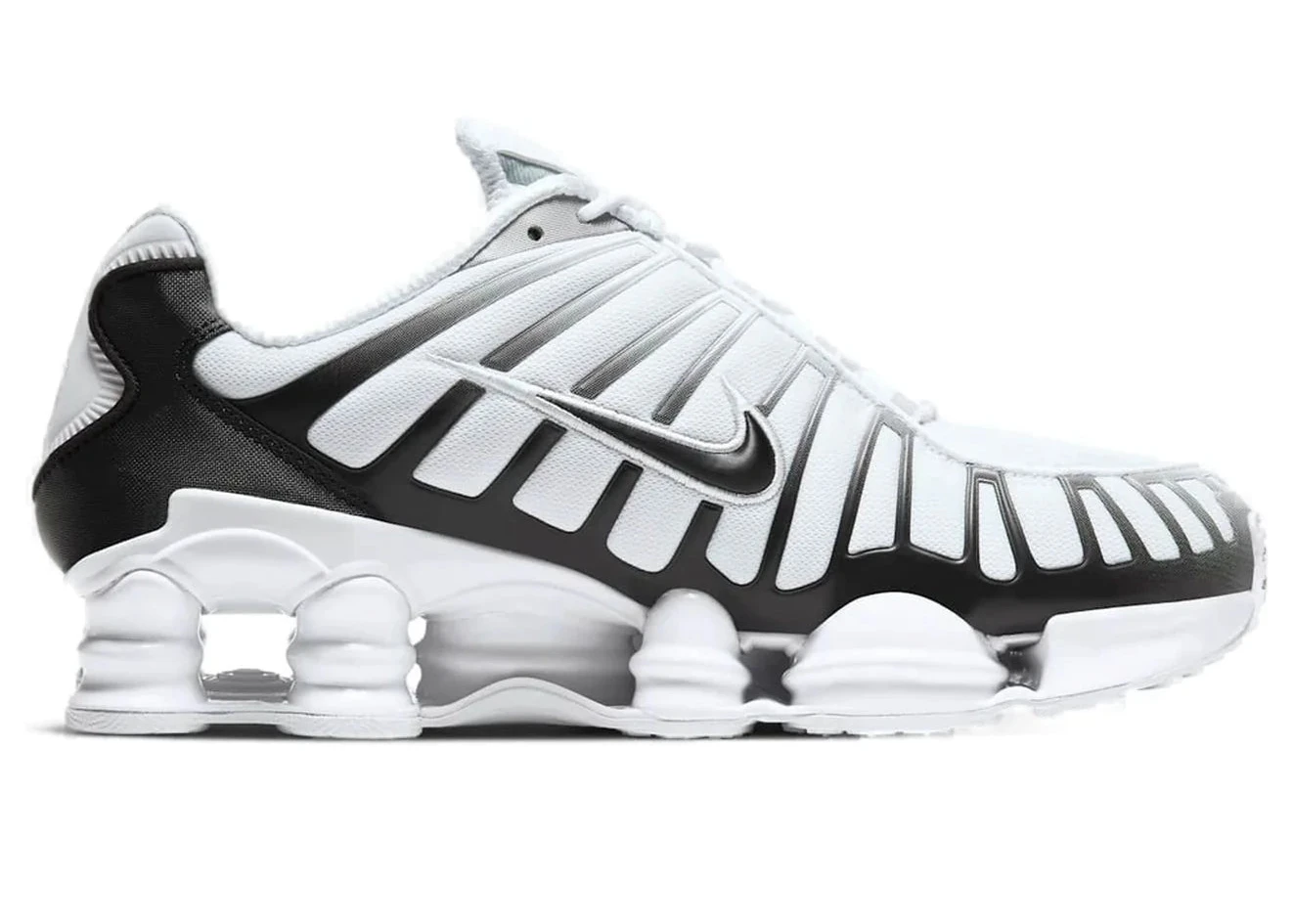 Nike Shox TL White Platinum avec tige en mesh respirant blanc, renforts synthétiques Platinum et semelle Nike Shox intégrale offrant amorti et stabilité vue de profil intérieur. 