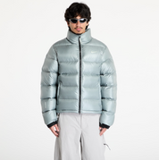 Nike x NOCTA Sunset Puffer Jacket Mica Green, doudoune vert mica métallisé avec matelassage, Swoosh Nike et logo NOCTA.