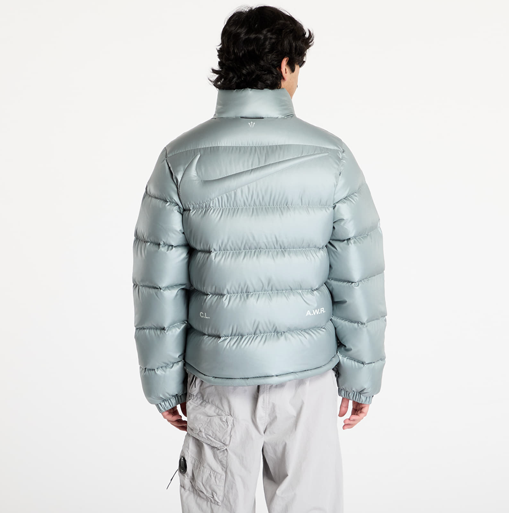 Nike x NOCTA Sunset Puffer Jacket Mica Green, doudoune vert mica métallisé avec matelassage, Swoosh Nike et logo NOCTA.