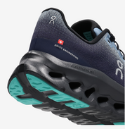 On Running Cloudtilt Dust Midnight, sneaker On Running gris et bleu nuit équipée de la technologie CloudTec Phase® et de l'amorti Helion™.