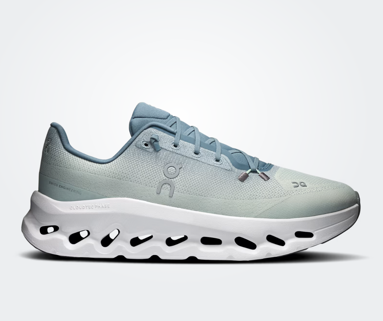 On Running Cloudtilt Tide Mineral, sneaker lifestyle bleue et grise équipée des technologies CloudTec Phase® et Helion™ offrant un amorti performant et un confort optimal.