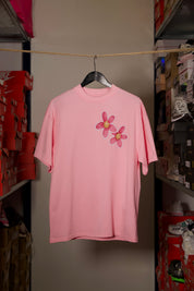 T-shirt Global Sneakers Concrete Bloom en coton premium 230 g fabriqué au Portugal, avec illustration florale signature sur la poitrine et dans le dos, disponible en Noir, Blanc, Lila et Verdeau.