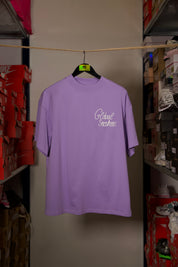 T-shirt Global Sneakers Unity Bloom en coton premium 230 g fabriqué au Portugal, avec logo brodé sur la poitrine et fleur GS en Puff Print au dos, disponible en Blanc, Rose, Vert et Lila.