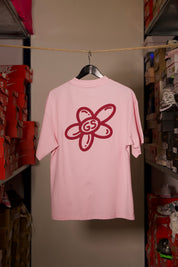 T-shirt Global Sneakers Unity Bloom en coton premium 230 g fabriqué au Portugal, avec logo brodé sur la poitrine et fleur GS en Puff Print au dos, disponible en Blanc, Rose, Vert et Lila.