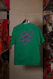 T-shirt Global Sneakers Unity Bloom en coton premium 230 g fabriqué au Portugal, avec logo brodé sur la poitrine et fleur GS en Puff Print au dos, disponible en Blanc, Rose, Vert et Lila.