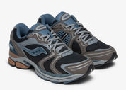 Saucony ProGrid Triumph 4 Winter Tech Pack Caviar Morel, sneaker rétro-running Saucony aux tons Caviar et Morel avec construction technique et amorti ProGrid.