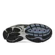 Saucony ProGrid Omni 9 Winter Tech Gravel Caviar en mesh technique renforcé avec détails minéraux et amorti ProGrid vue sur la semelle extérieure. 