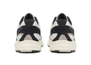 Sneakers Saucony Grid Ride Millennium blanches et noires en suède et textile avec technologie Grid et design running rétro.Vue arrière 