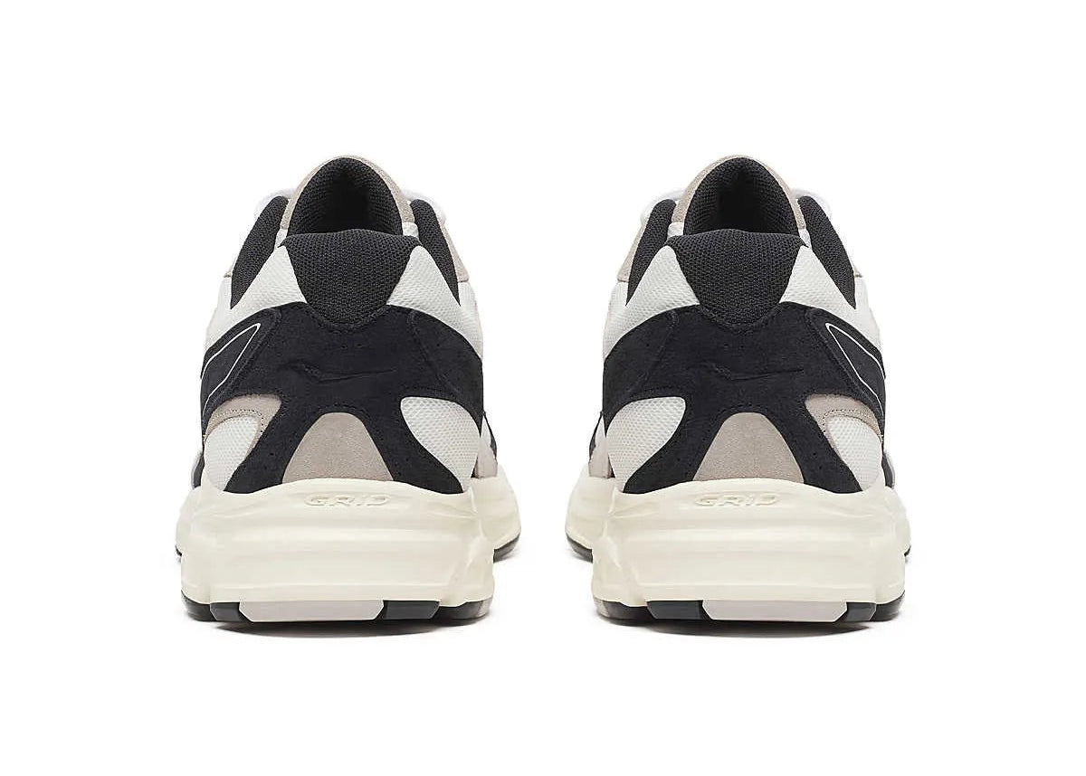 Sneakers Saucony Grid Ride Millennium blanches et noires en suède et textile avec technologie Grid et design running rétro.Vue arrière 