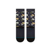 Paire de chaussette bleu marine à motif fleurs vert, blanc et jaune. La paire de chaussette est vue de derrière