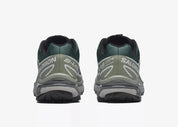 Sneaker Salomon XT-6 Bistro Green Milieu en mesh vert foncé avec détails naturels, système Quicklace, amorti EnergyCell et semelle Contagrip.