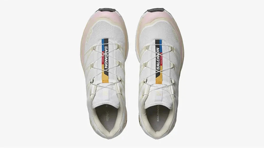 Sneaker Salomon XT-6 White Almond Milk Fairy Tale en mesh blanc avec détails crème et rose pastel, système Quicklace, amorti EnergyCell et semelle Contagrip.