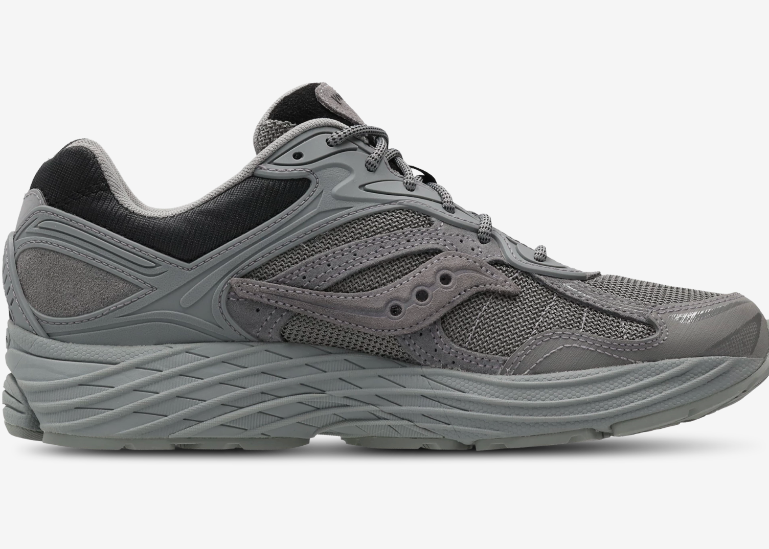 Saucony ProGrid Omni 9 Armor Grey, sneaker running rétro grise en mesh avec renforts synthétiques ton sur ton et semelle épaisse vue de profil intérieur. 