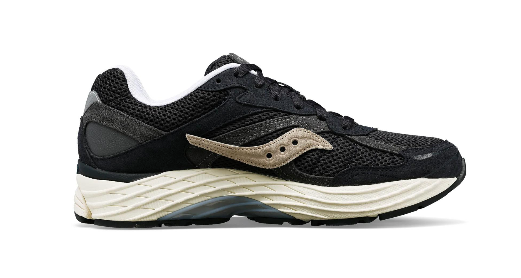 Saucony ProGrid Omni 9 Navy Grey, sneaker Saucony bleu marine et grise avec construction multicouche et silhouette technique rétro-running vue de profil intérieur. 