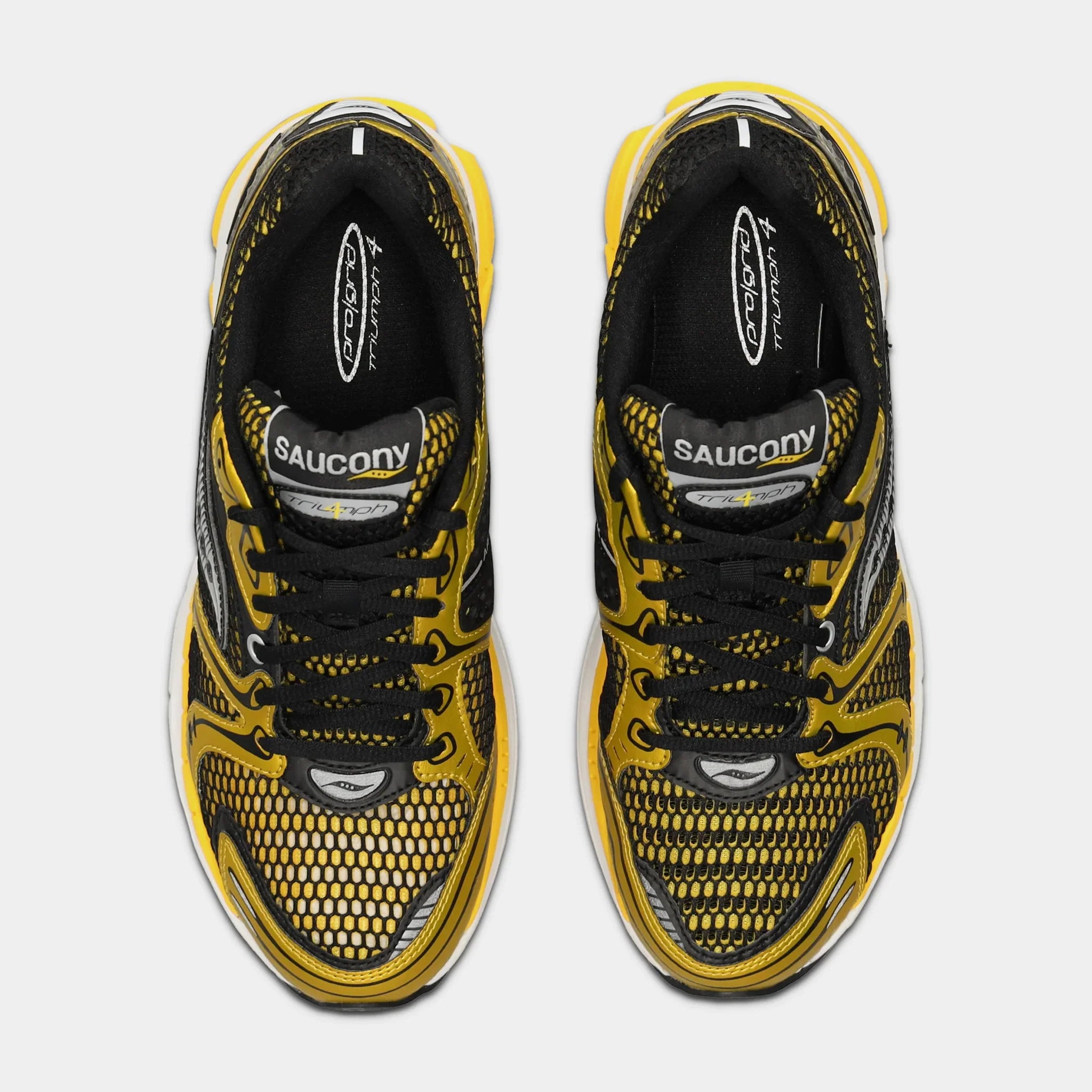 Saucony ProGrid Triumph 4 Lemon Chrome en mesh blanc avec superpositions jaune métallisé et amorti ProGrid.