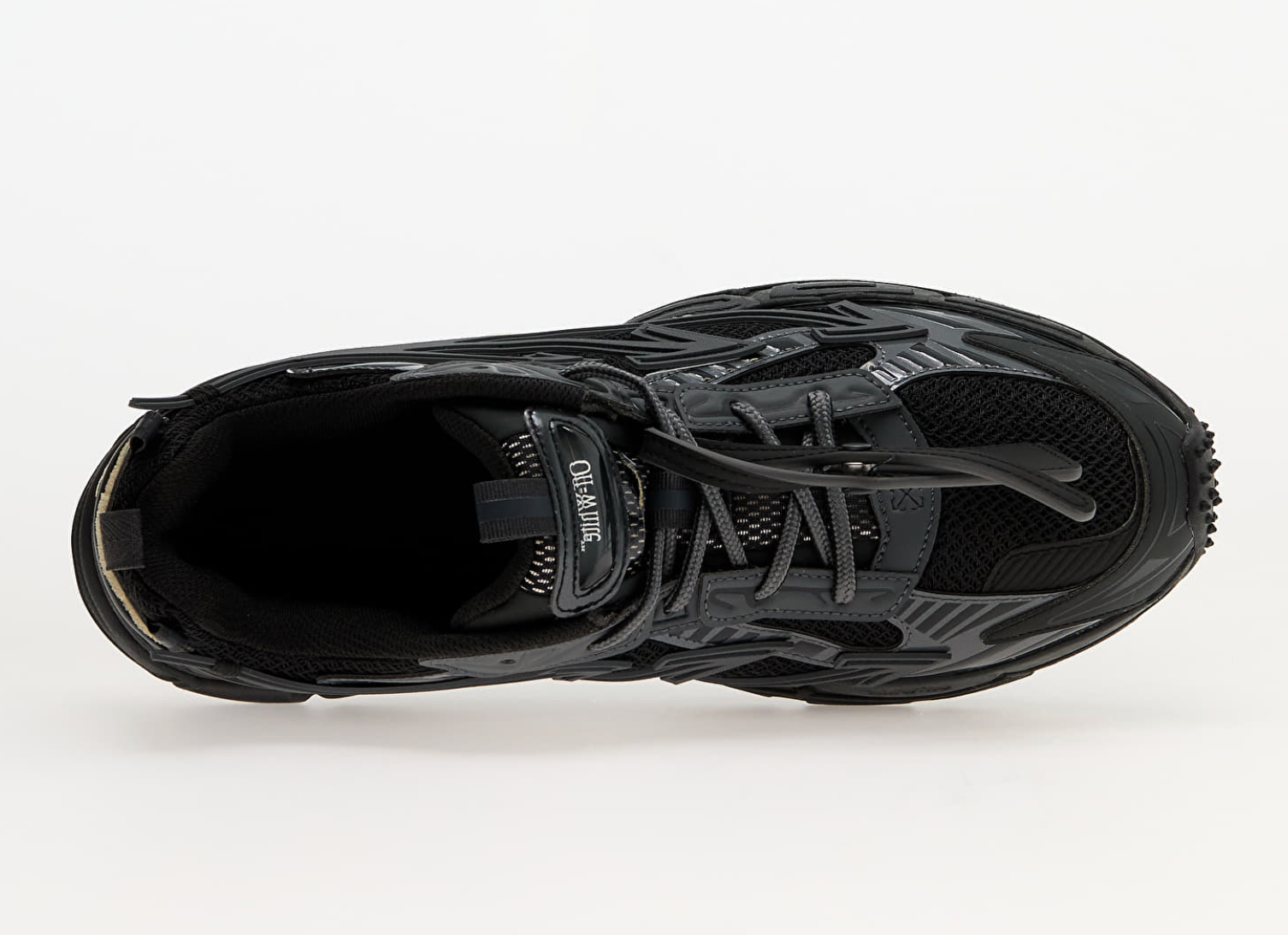 OFF-WHITE Be Right Back Black avec tige en mesh respirant, empiècements en cuir, daim et matières synthétiques noires, silhouette running moderne et semelle en caoutchouc.