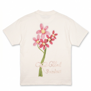 T-shirt Global Sneakers Concrete Bloom en coton premium 230 g fabriqué au Portugal, avec illustration florale signature sur la poitrine et dans le dos, disponible en Noir, Blanc, Lila et Verdeau.